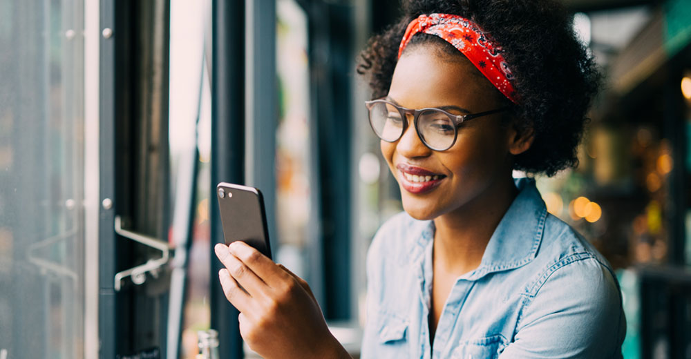 woman reading a text marketing message